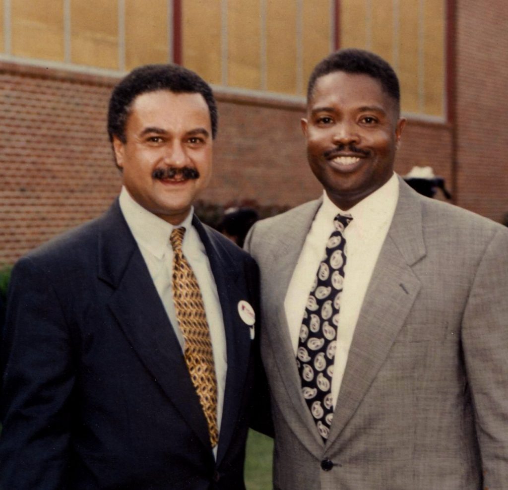 Photograph of James Ewers on the Right with Ron Brown on the Left, first African American to serve as the U. S. Secretary of Commerce
